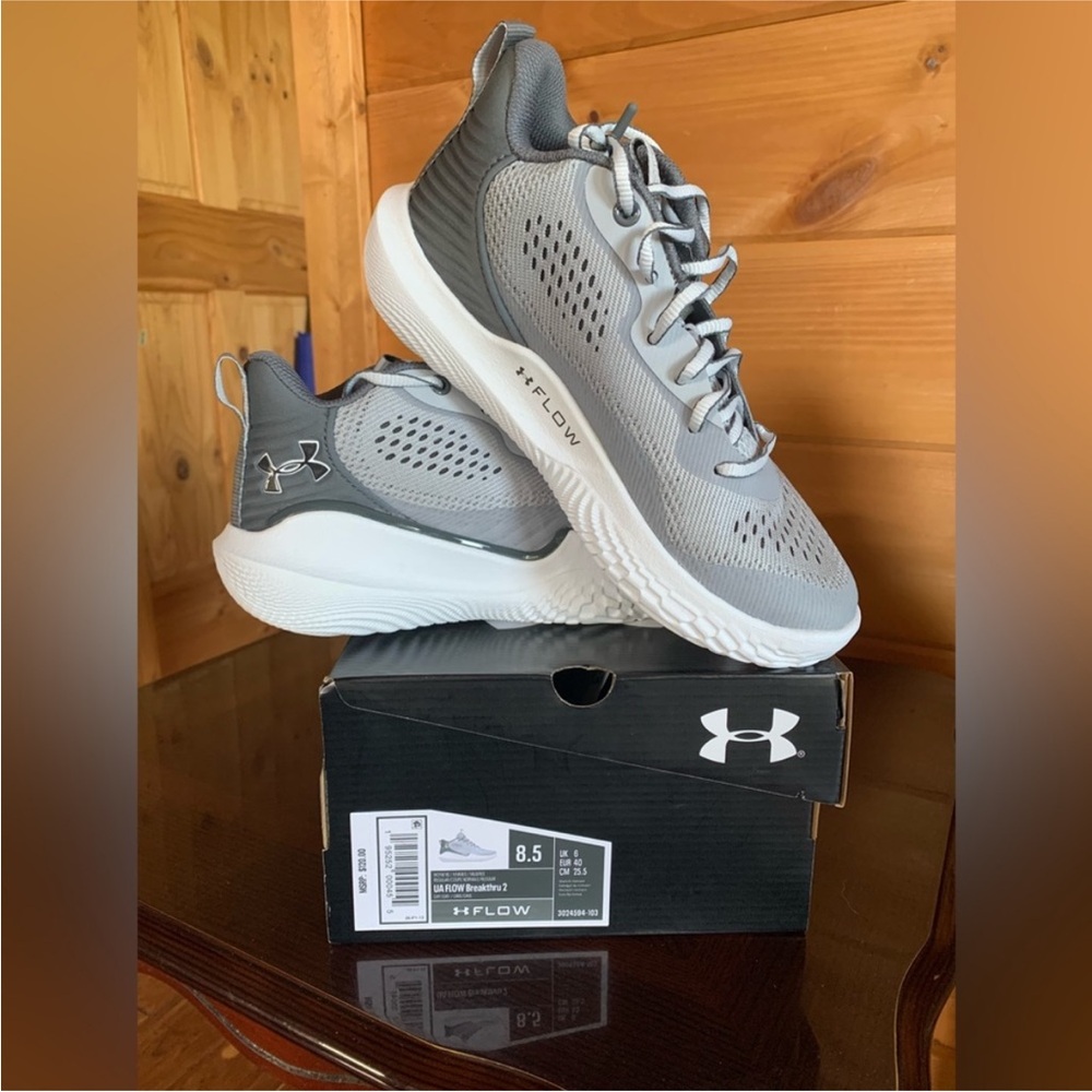 Women’s 8.5/ men’s 6.5 Steph Curry UA basketball shoes.